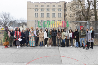President Michelle J. Anderson (right) join student interns at the burial grounds, along with CUNY Chancellor Félix V. Matos Rodríguez and African Burial Grounds Coalition President Samantha Bernardine, on February 16 for a walking tour.  