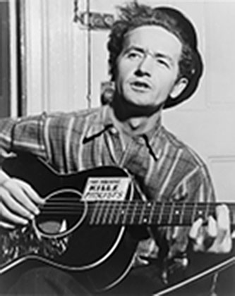 Woody Guthrie, Photograph by Al Aumuller, courtesy of the Woody Guthrie Archives