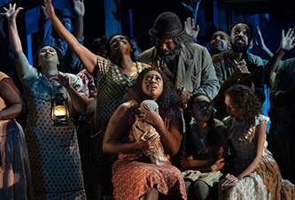 Residents of Catfish Row shelter from the hurricane from Met’s production of <em>Porgy and Bess</em> (2019)