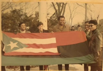 Members of BLAC and PRA displaying their flags