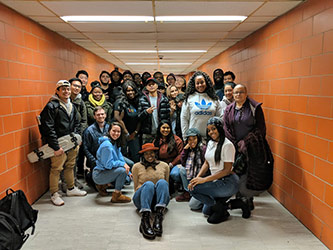 Assistant Professor Donna Granville (center front with hat) and her students.