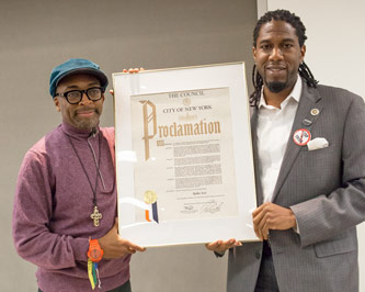 Famed filmmaker Spike Lee receives a New York City proclamation from Councilman Jumaane Williams '95.