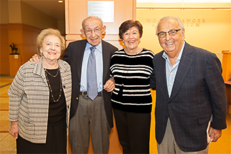 Left to right: Connie Stopol, Philip Stopol '47, Irene Stein '47, and Howard Stein '47 are all smiles in front of the Stopol plaque in the Brooklyn College Library.