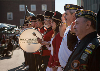 Veterans alongside a marching band from the Netherlands on the Brooklyn College campus for the annual Veteran's Day luncheon.
