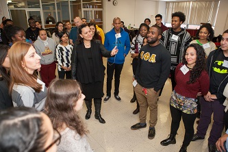 The first of three Brooklyn College Rhodes Scholars, Lisette Nieves ’92 (center) shares what she learned about leadership with students, including senior Mickael Dejean (in black sweatshirt to Nieves’ left), at a special leadership workshop in the Student Center.