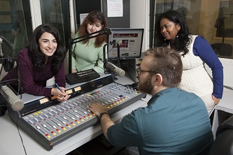 Each time Forlano and her student interns produce <em>The Julianna Forlano Show</em>, (from Brooklyn College's very own radio station, WBCR), listeners nationwide can count on two things: political consciousness-raising and hilarity. (Clockwise from left: Forlano, Faina Cordover, Chantelle Teekasingh, and Charles Carr)