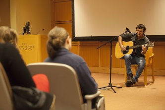 Visiting senior Nate Bondy sang and strummed, despite his nervousness, to deliver a well-received performance at the open mic.