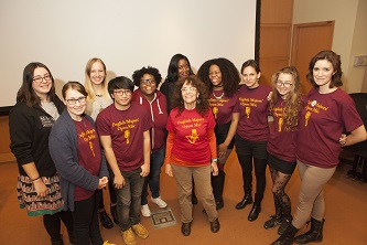 Professor Roni Natov '65 (center), and her group of interns strive to create a supportive, inclusive environment with their bi-annual English Majors' Open Mic event.