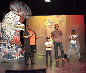 Brooklyn's Best host J.J. Mattise introduces the third group of contestants in the program's premiere show. The trio of break dancers went on to win that night. 