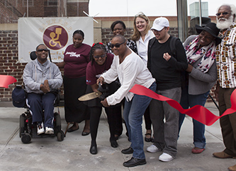 Members of S.O.F.E.D.U.P. and the disabled community celebrate the opening of the new Bedford Avenue Access-a-Ride shelter with President Michelle Anderson.
