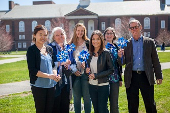 The Brooklyn College community gathers in support of child abuse prevention. Left to right: student Jasmine Lee; Christine Pawelski Ed.D.; students Elizabeth Koennicke, Jennie Guzman, and Amelia Blackwood;<span style=