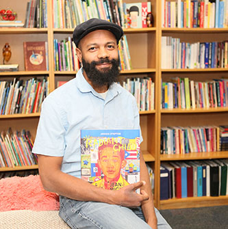 Javaka Steptoe with his latest book about Jean-Michel Basquiat. 