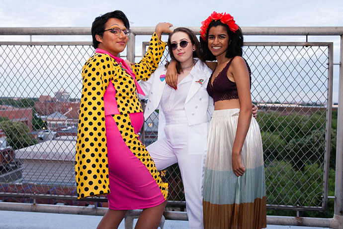 Daniel Vázquez Sanabria, left, with his two friends Nerea Blanco, (center) and Dena Bhagalia on the rooftop of the Student Center for the queer prom. 