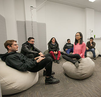 Students test out the bean bags in the new Room for Quiet Reflection. 