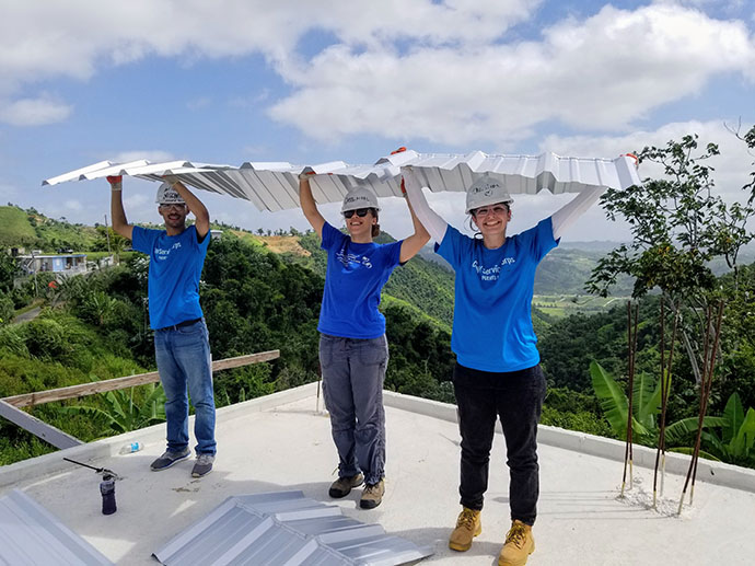 Nischal Giri, far left, working on a roof in Puerto Rico with his CUNY crew. Photo courtesy of Nischal Giri