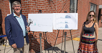 Brett Branco stands with a sensor and a data board with Rebecca Fischman, Senior Policy Advisor from the Mayor’s Office of Climate and Environmental Justice, on September 1 where Mayor Eric Adams announced various stormwater infrastructure initiatives aimed at making the city more resilient to extreme rainfall in the future.